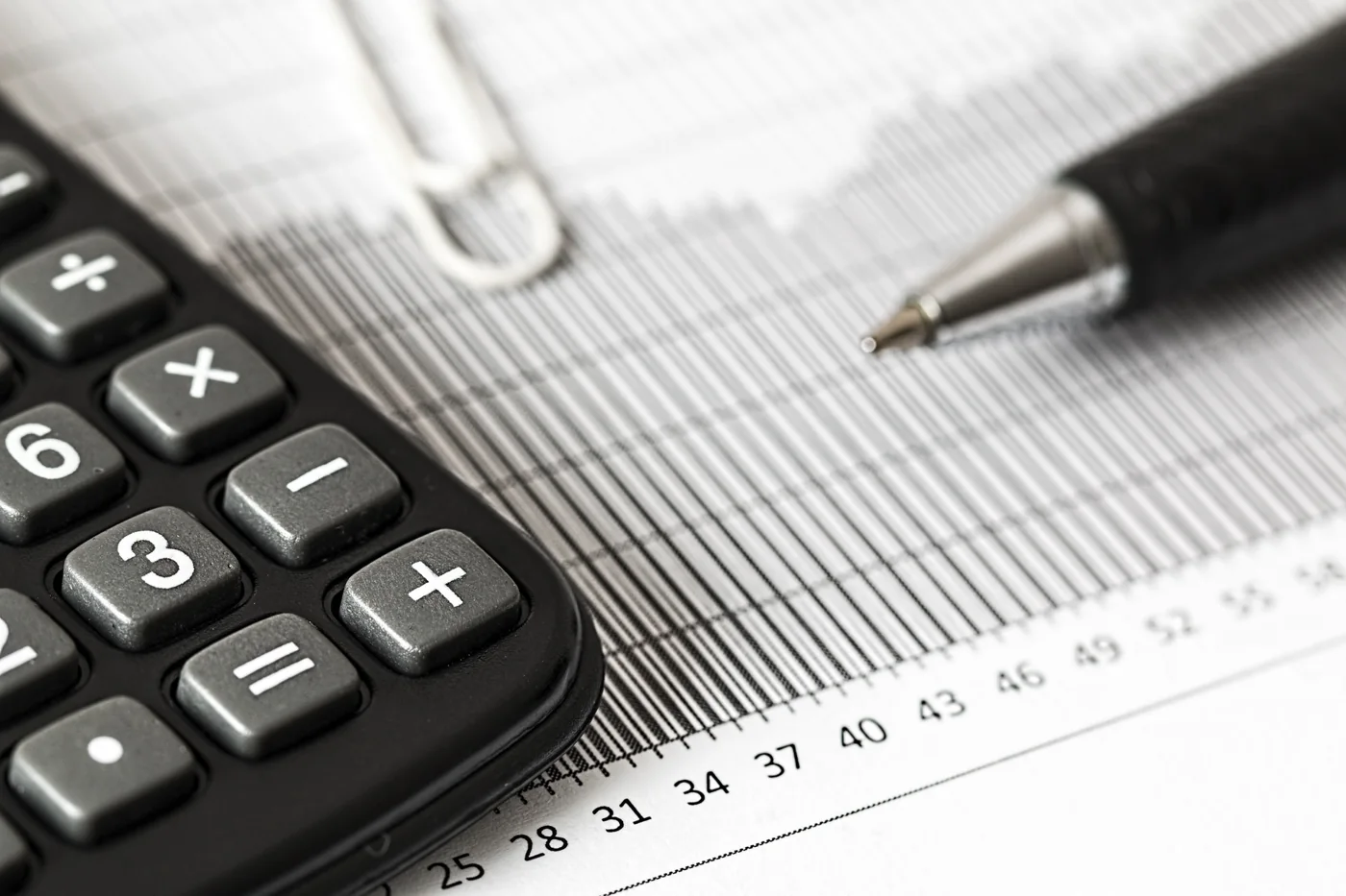 Financial documents and calculator on a desk